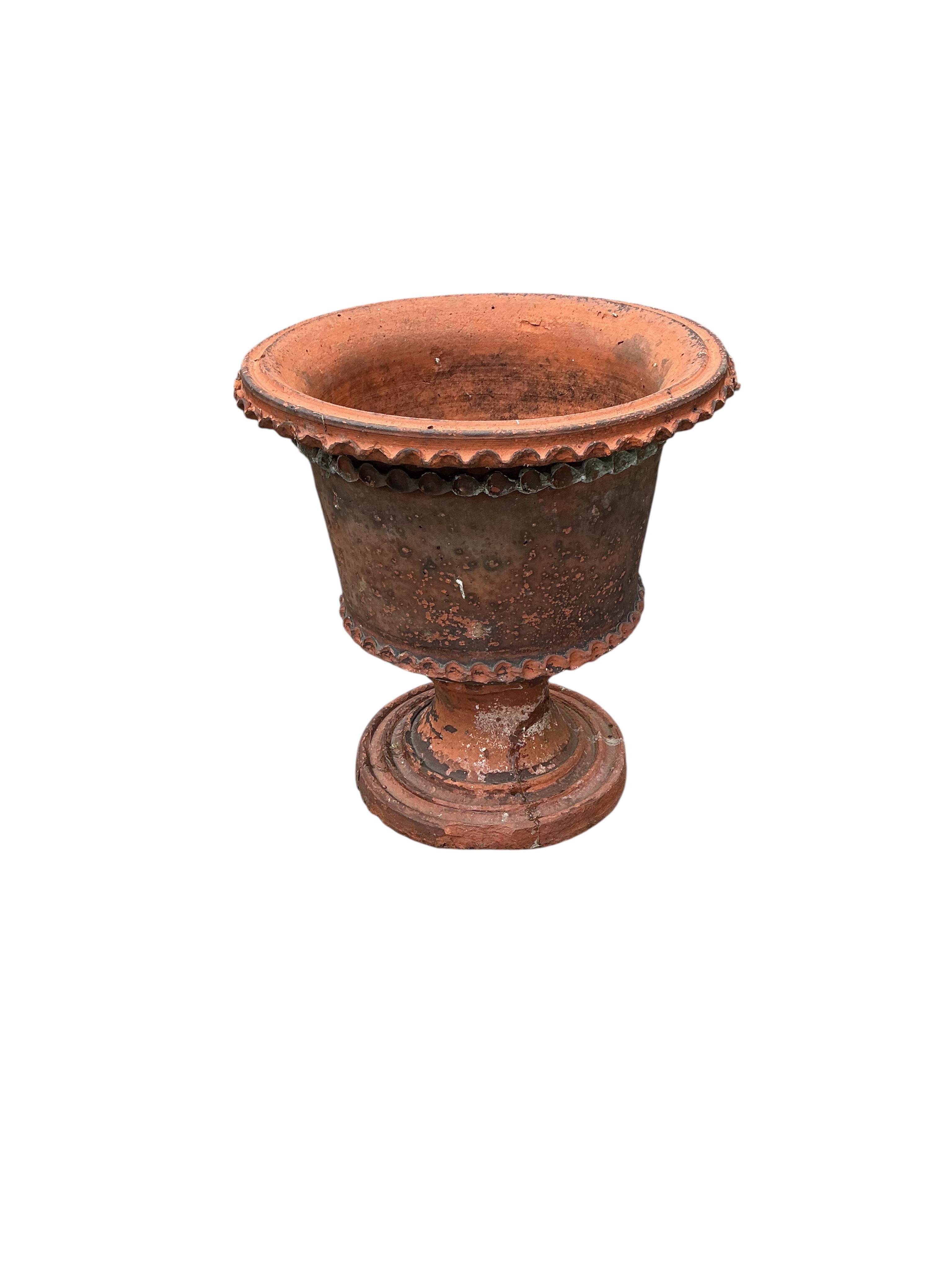 A terracotta urn, diameter 40cm, height 43cm